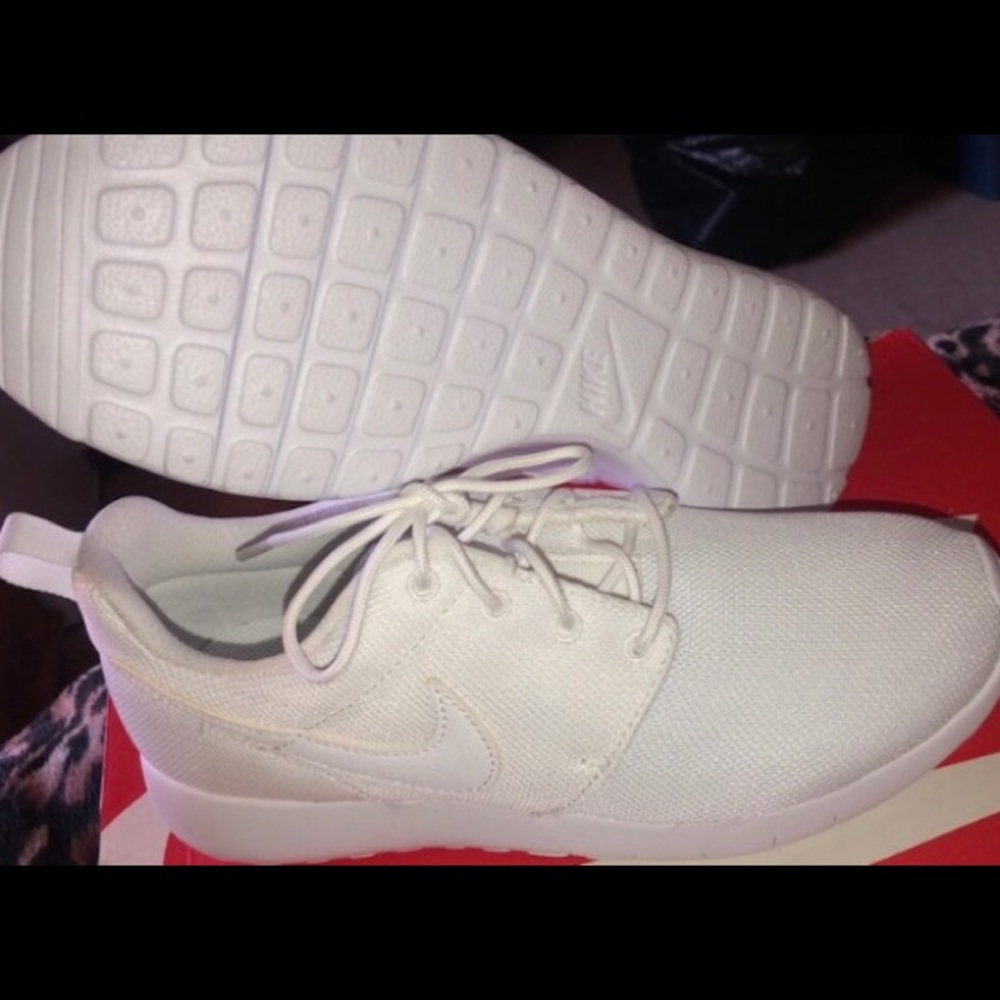 All white Nike Roshes
